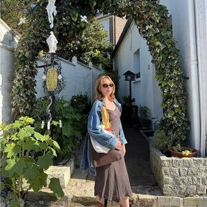 French spaghetti strap midi-length brown polka dot dress